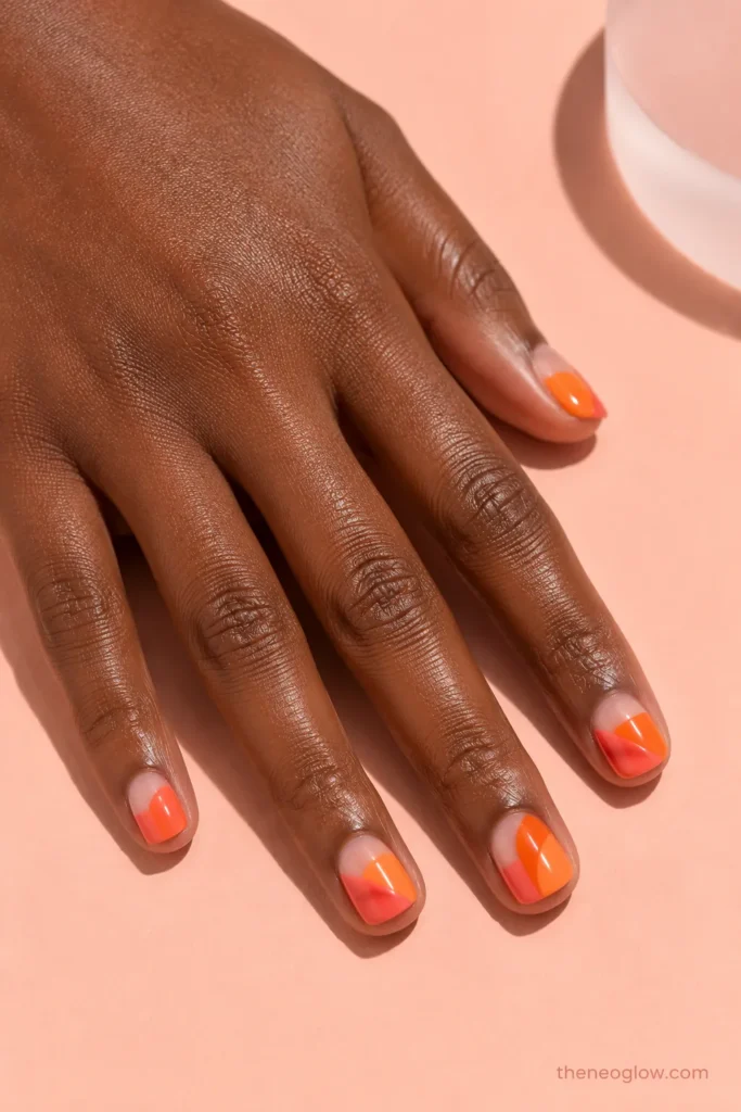 Short square coral and tangerine color-block summer nails