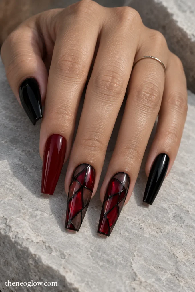Glossy long coffin nails with crimson stained-glass panes divided by fine black lines.