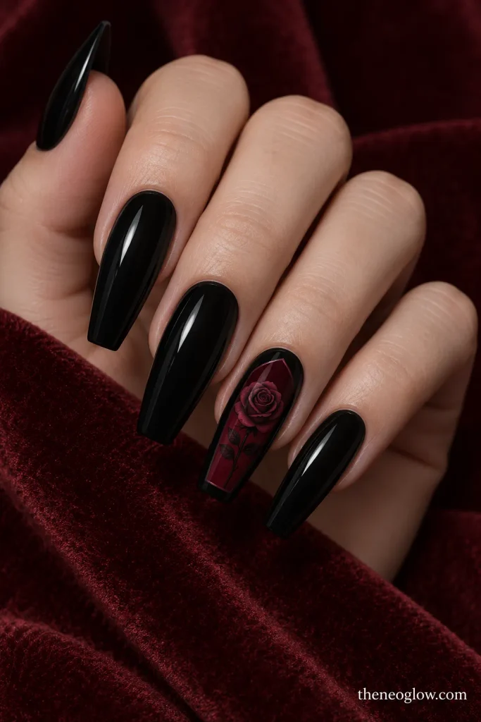 Black coffin nails with a deep-wine panel and a flat tonal rose accent.