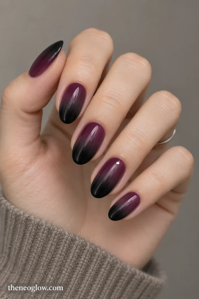 Plum-to-black gradient nails with a soft foggy fade and tiny silver dot accents on the ring fingers.