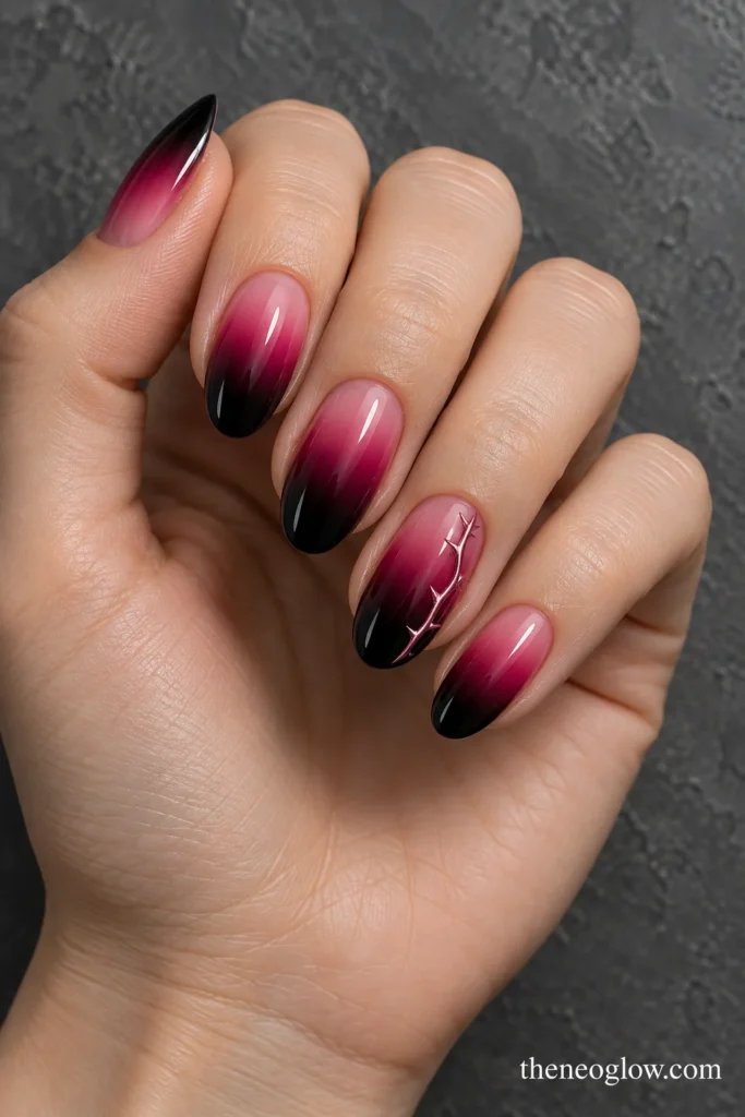Black-to-magenta ombré nails with one slim pink chrome thorn line along an accent nail. pink halloween nails