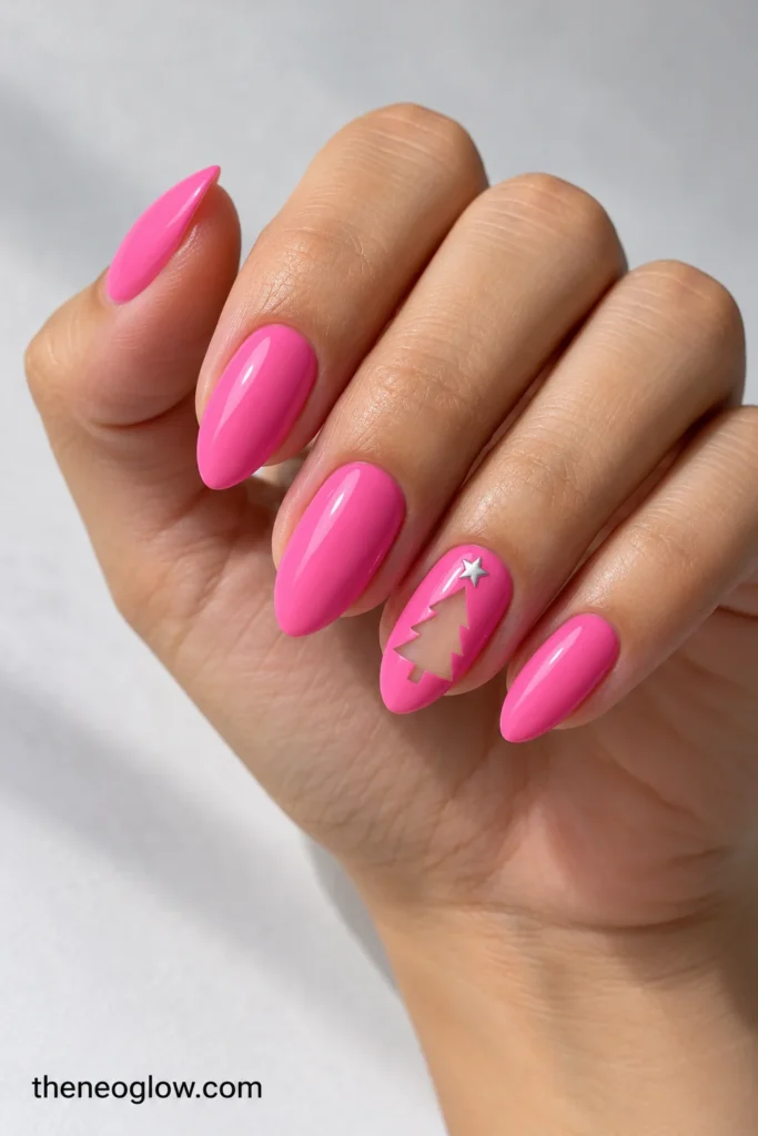 Medium glossy bubblegum-pink almond nails with one transparent Christmas-tree cutout and a tiny silver star.