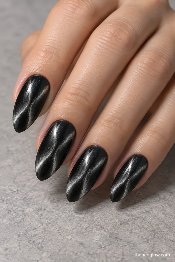 Charcoal almond nails with two slim silver magnetic beams forming an hourglass effect