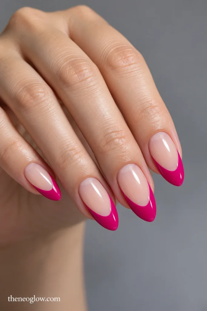 Medium almond nails with deep glossy fuchsia French tips extending into long curved side wings.