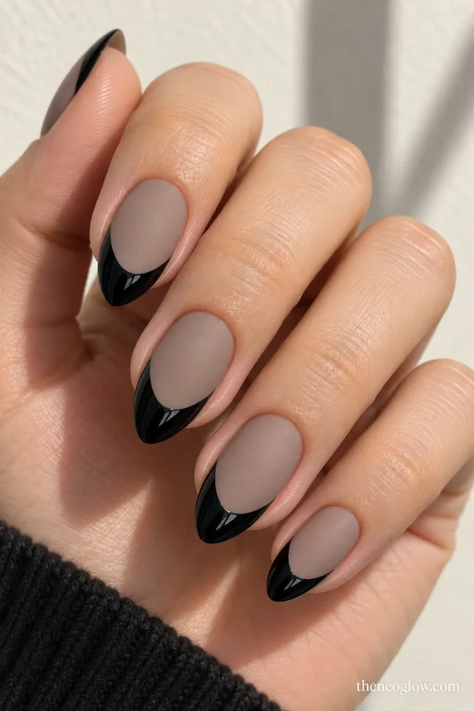 Tapered-square nails with narrow gunmetal mirror-chrome French tips over milky pink bases.