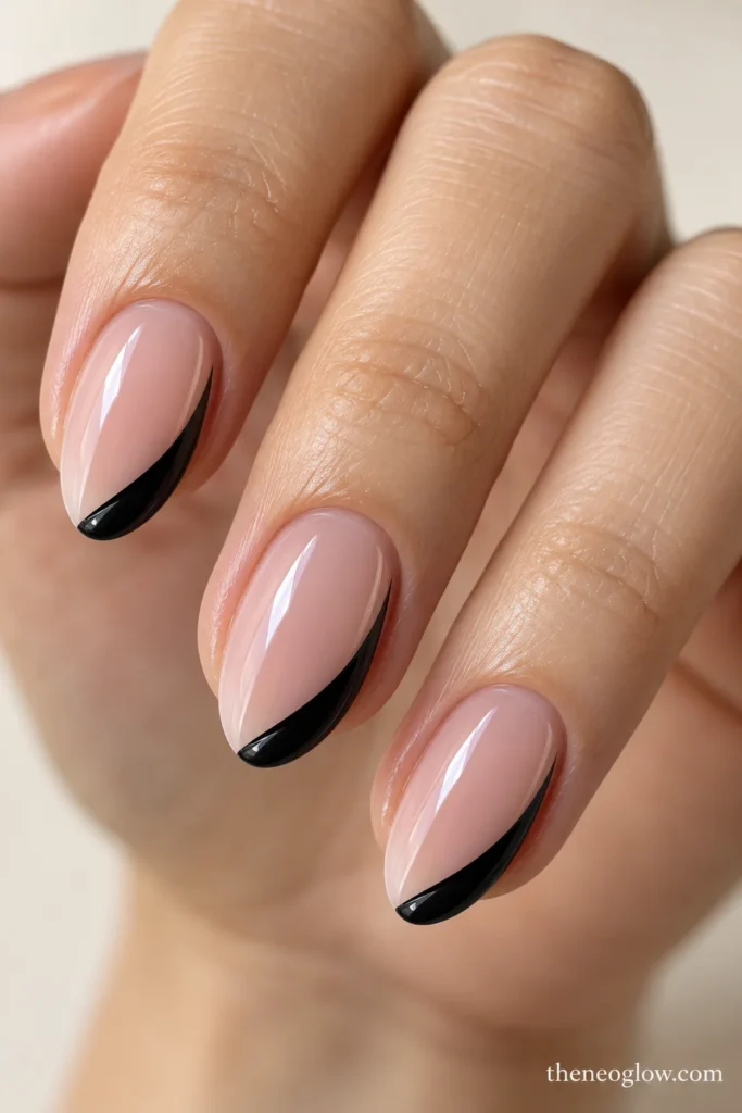 Oval nails with a curved black ribbon sweeping from the right tip corner toward the center.
