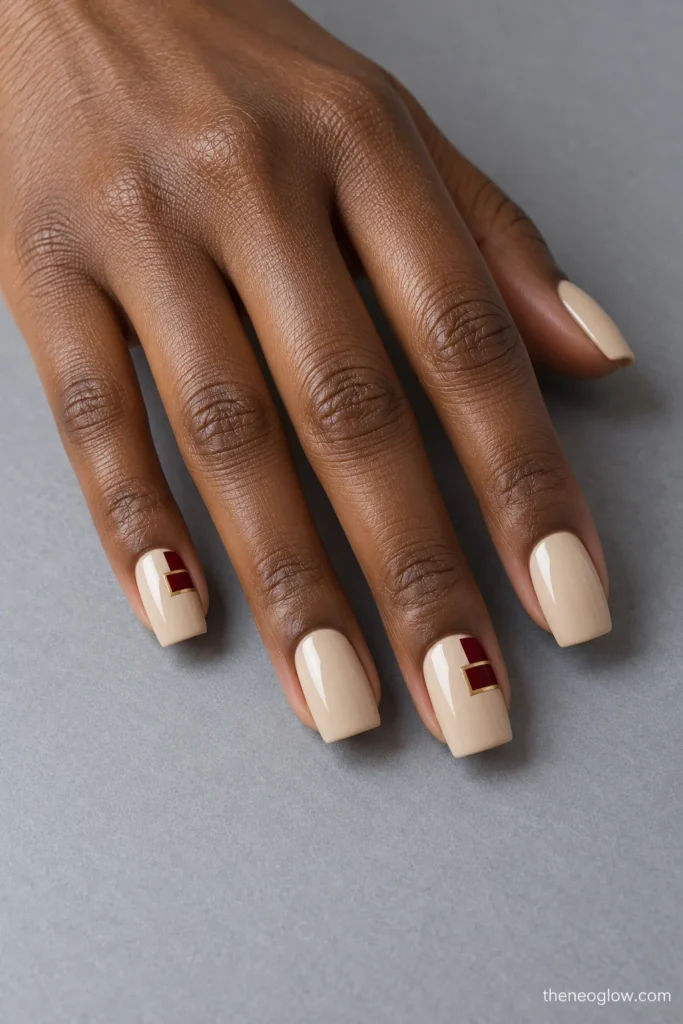 Medium square praline nails with stepped garnet rectangles and a thin antique-gold border on two accents.