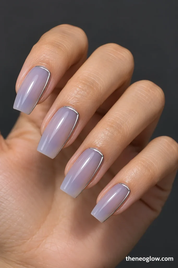 Medium tapered coffin nails with sheer blue-lilac wash and open silver frames.