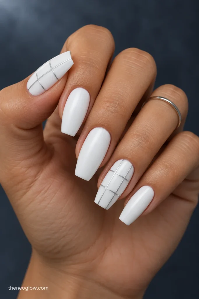 Medium white satin coffin nails with fine silver windowpane grids on the thumb and ring finger.