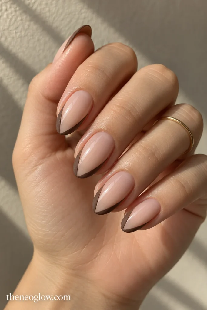 Medium almond nails with matte suede-brown side wings and glossy sheer centers.