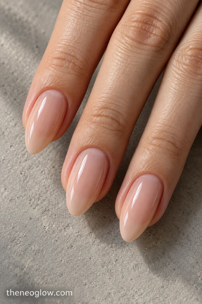 Medium almond nails with balanced side taper and softly rounded center peaks.